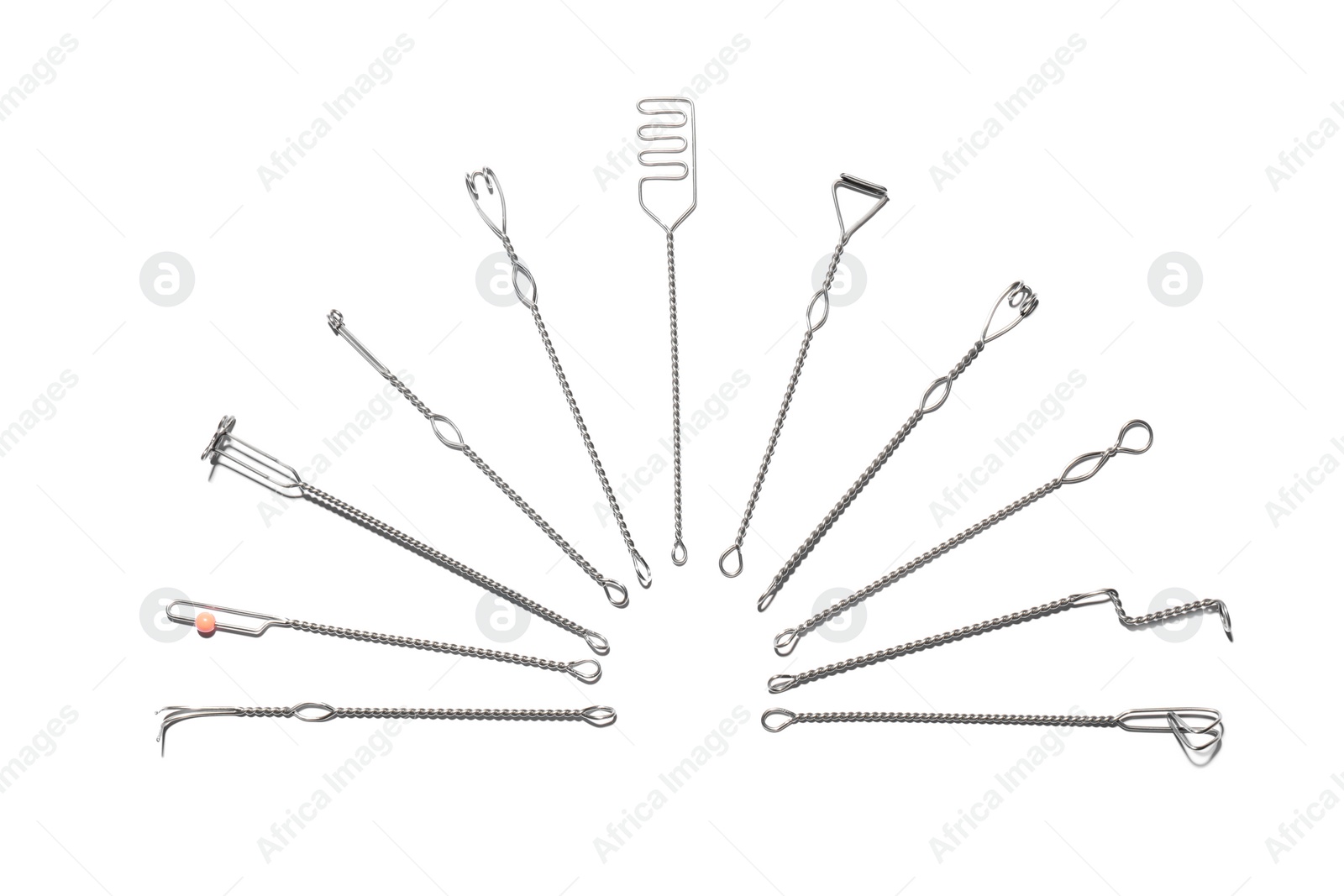 Photo of Set of logopedic probes on white background, top view. Speech therapist's tools