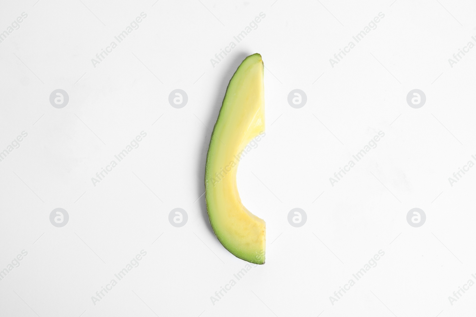 Photo of Slice of avocado on white background