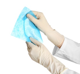 Photo of Doctor in medical gloves holding cloth on white background