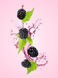 Image of Fresh blackberries and juice in air on pink background