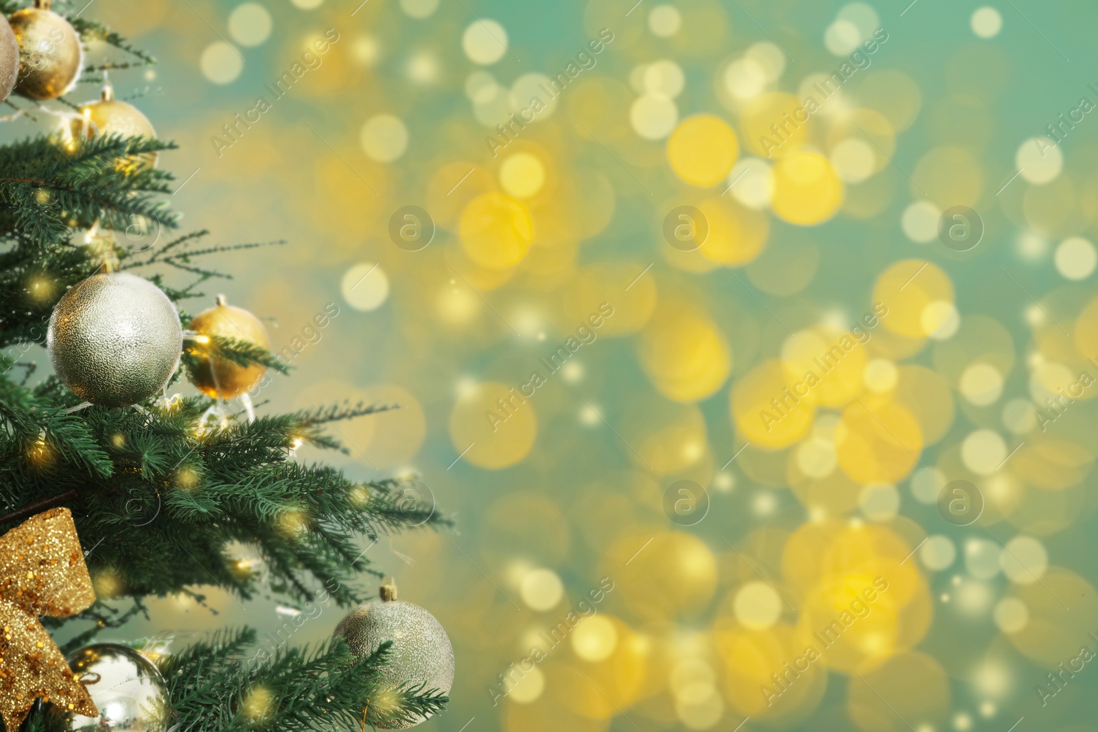 Image of Beautiful Christmas tree with bright baubles against blurred lights on turquoise background, closeup. Space for text