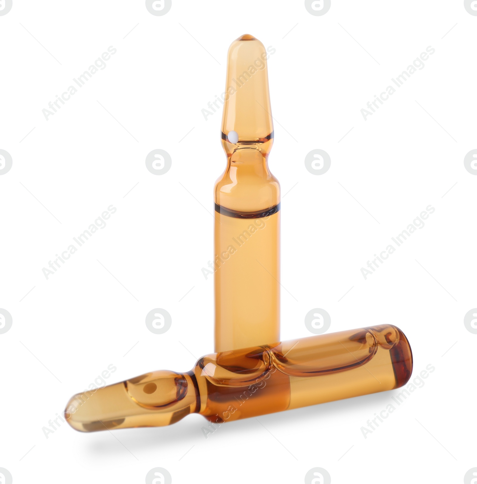 Photo of Brown pharmaceutical ampoules with medication on white background