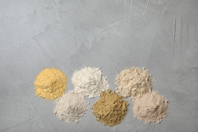 Photo of Composition with different types of flour on light background