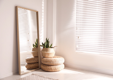 Large stylish mirror in room, space for text. Element of interior design