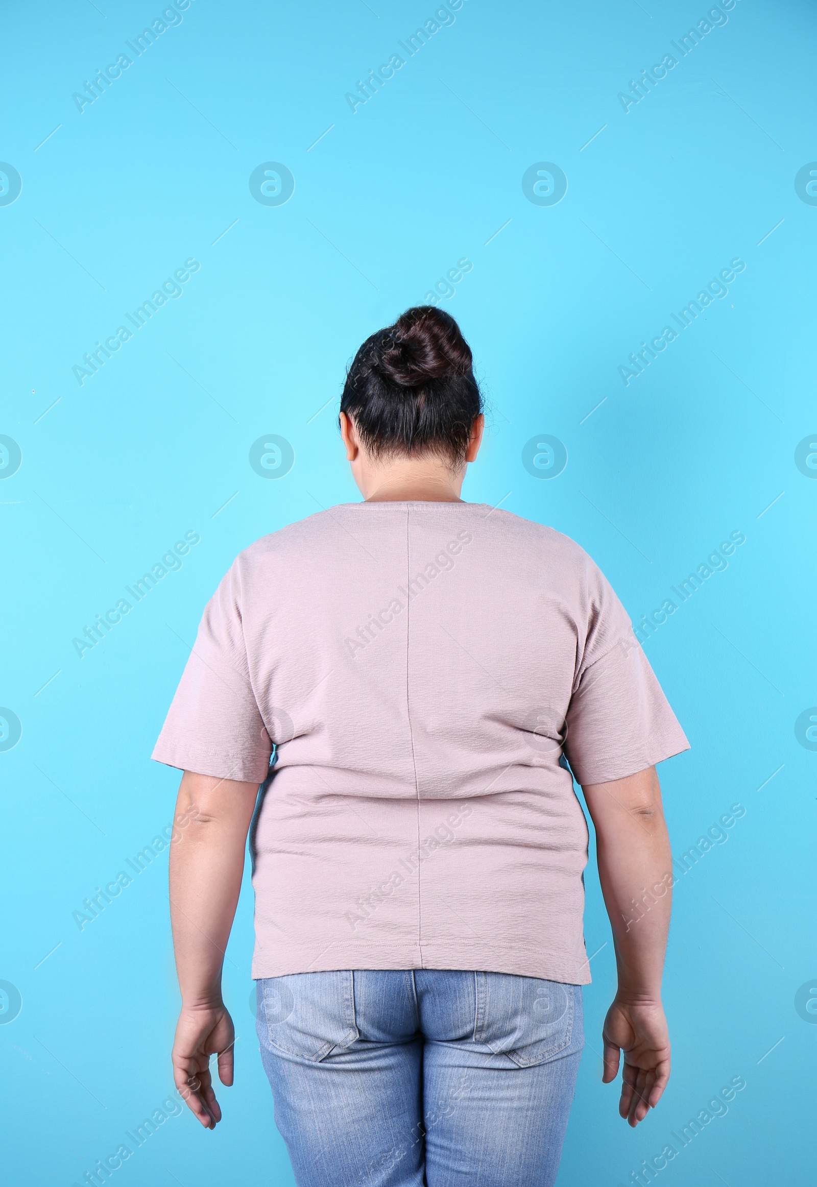 Photo of Fat woman on color background. Weight loss