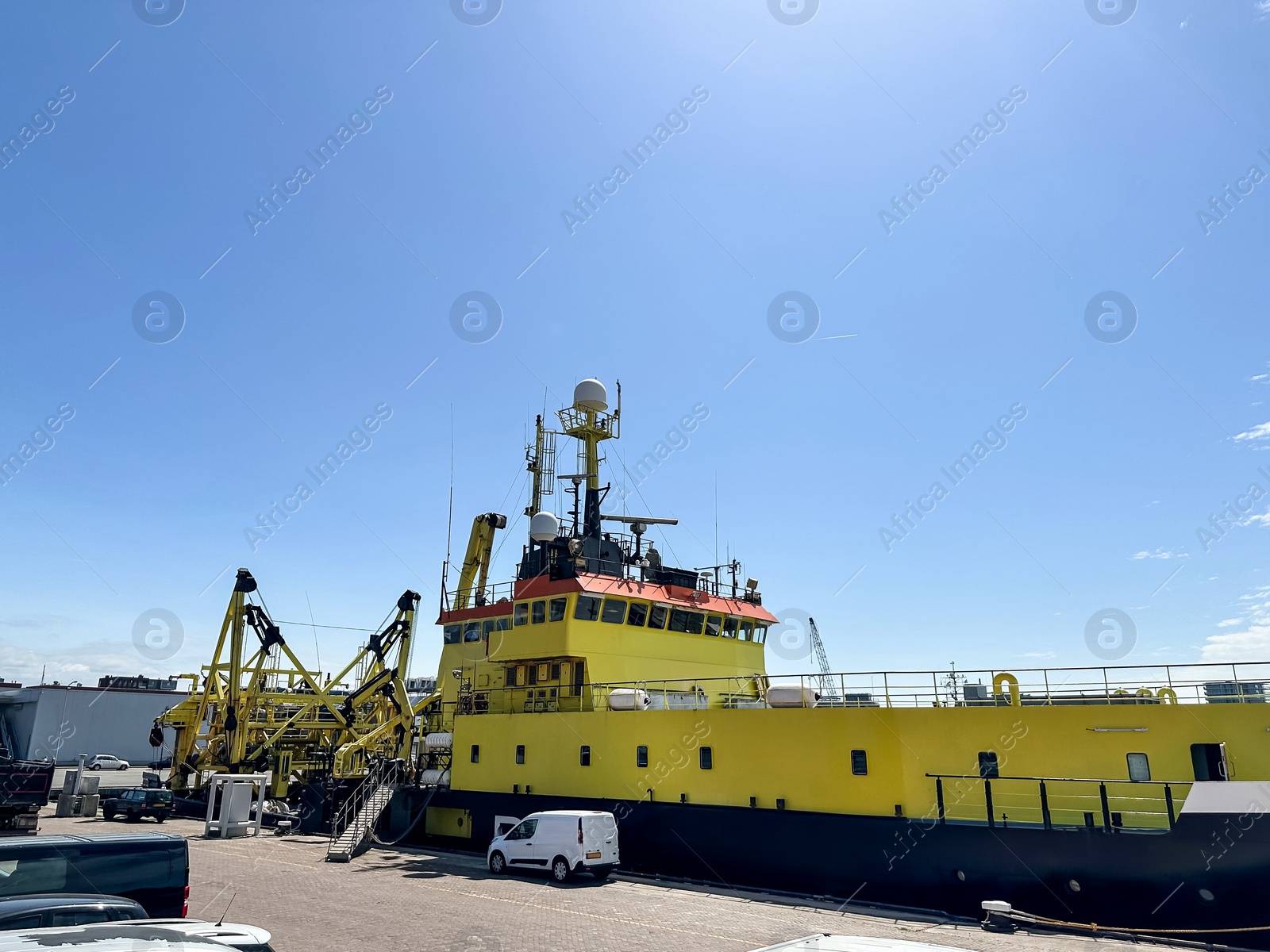 Photo of Ship moored in sea port on sunny day