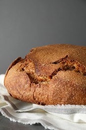 Freshly baked sourdough bread on table against grey background