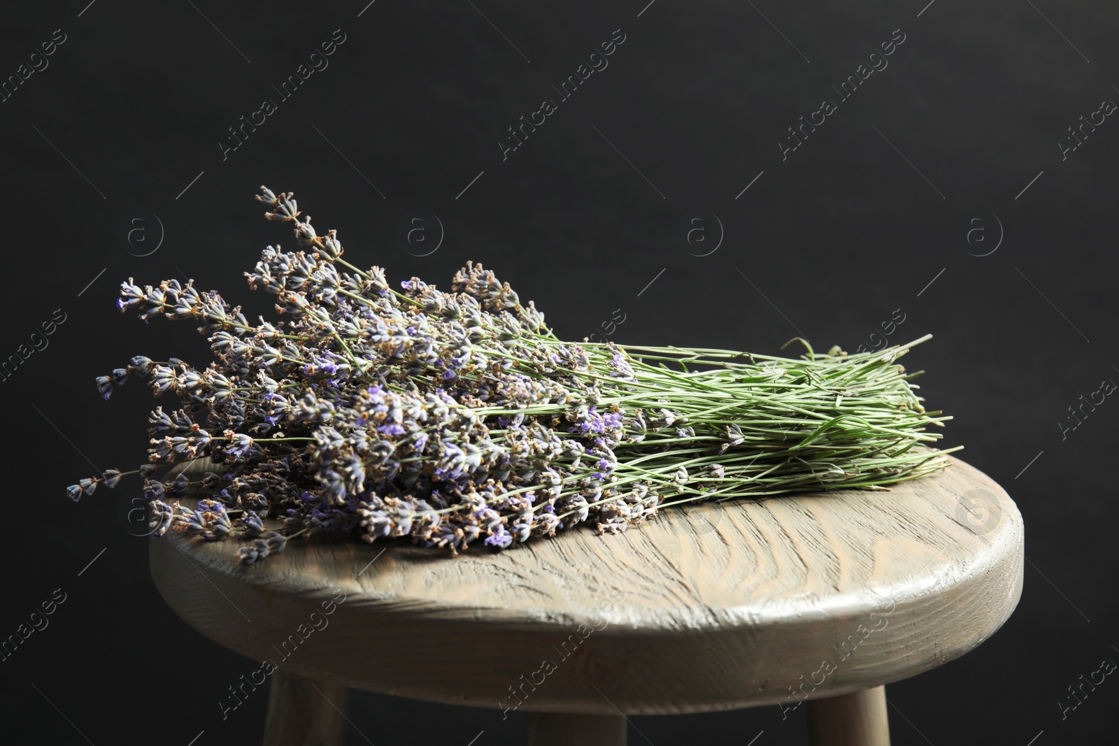 Photo of Beautiful blooming lavender flowers on wooden table