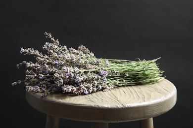 Photo of Beautiful blooming lavender flowers on wooden table