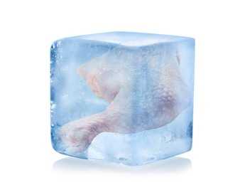 Image of Frozen food. Raw chicken leg quarter in ice cube isolated on white
