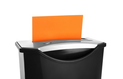Photo of Shredder with sheet of orange paper isolated on white
