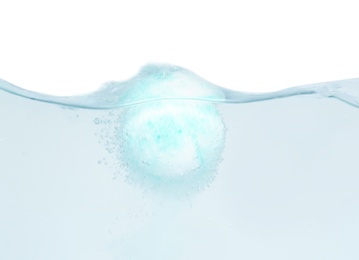 Photo of Bath bomb in water on white background