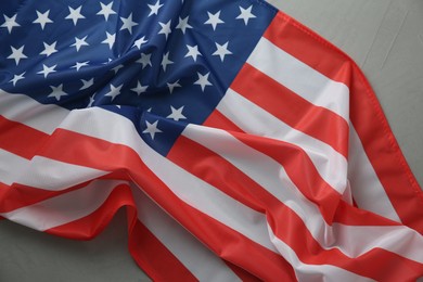 Photo of Flag of USA on light grey table, top view