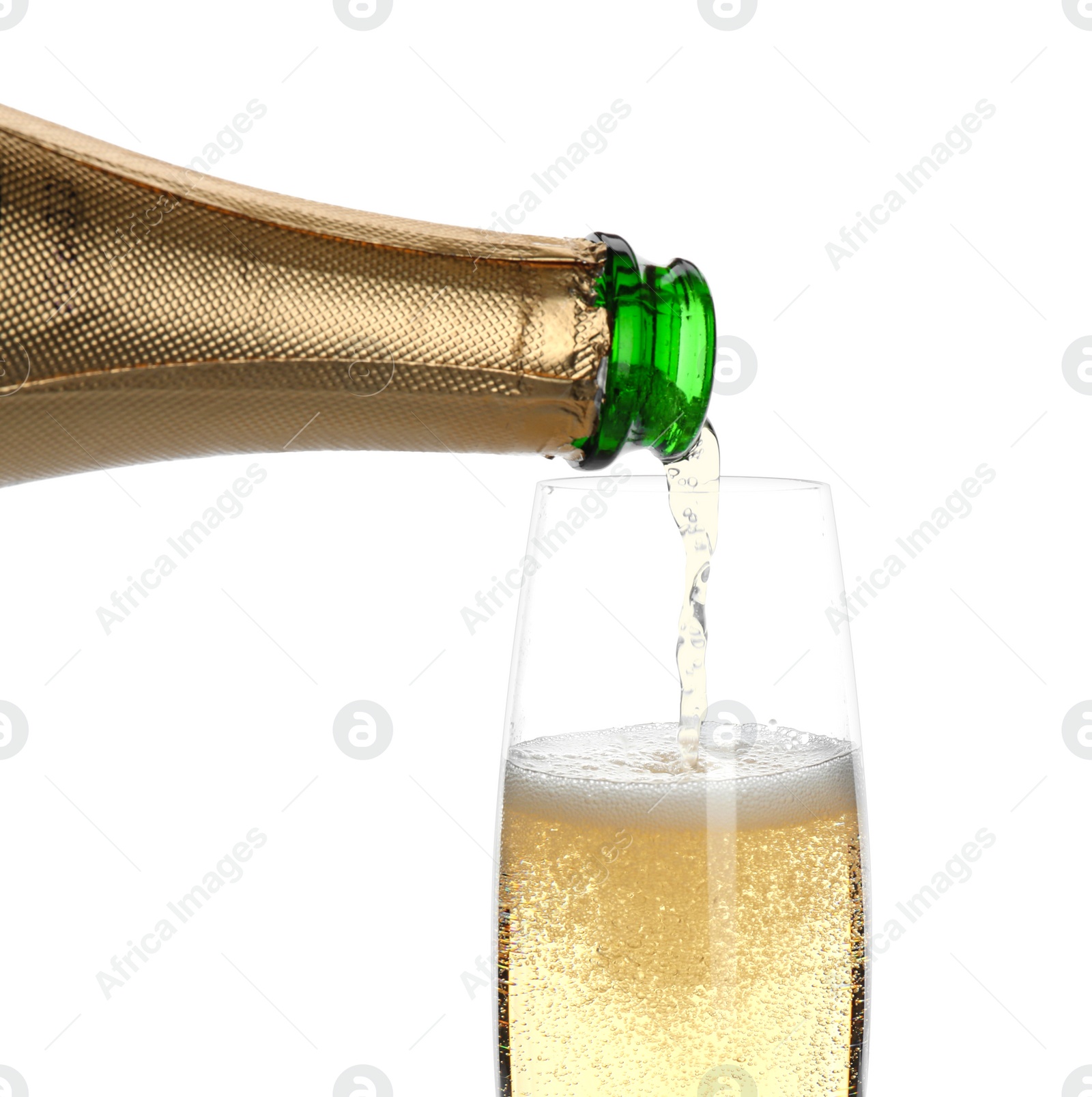 Photo of Pouring champagne from bottle into glass on white background. Festive drink