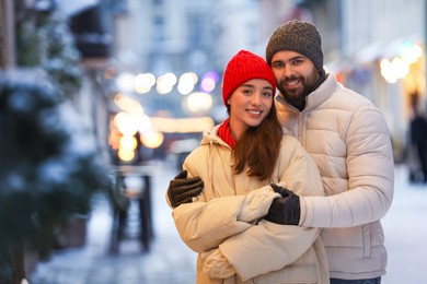 Lovely couple spending time together on city street