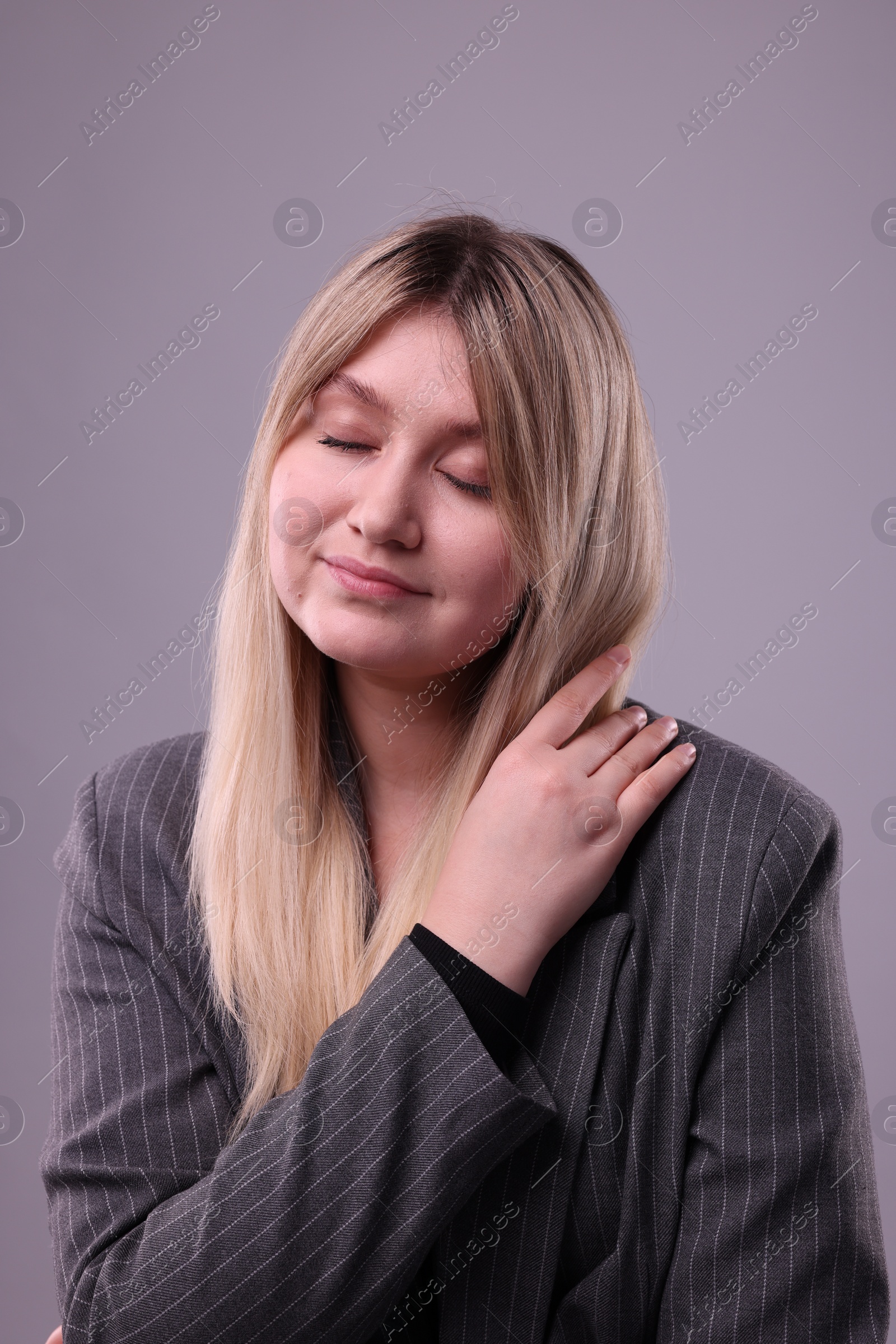 Photo of Portrait of beautiful young woman on grey background