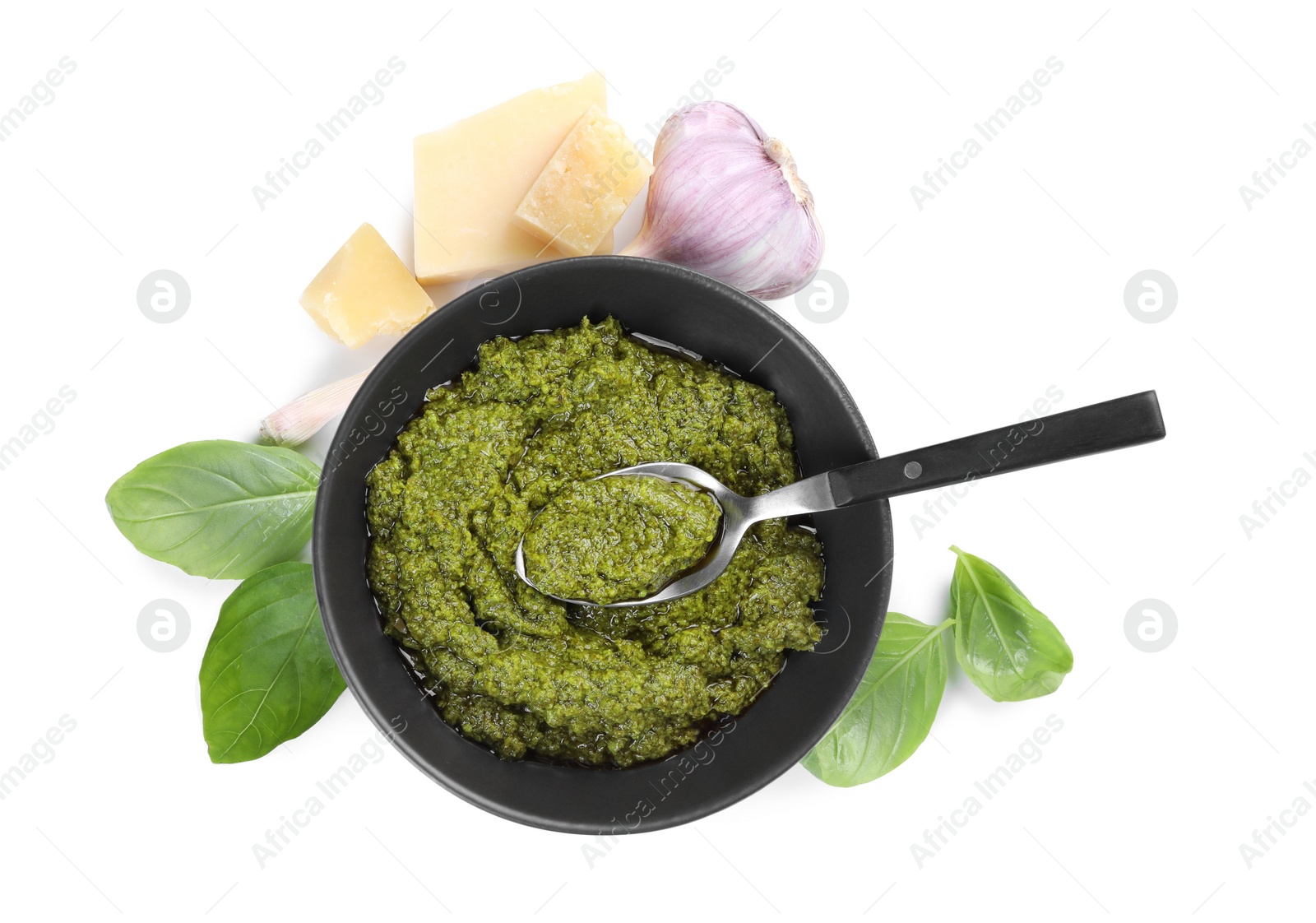 Photo of Fresh tasty pesto sauce and ingredients isolated on white, top view