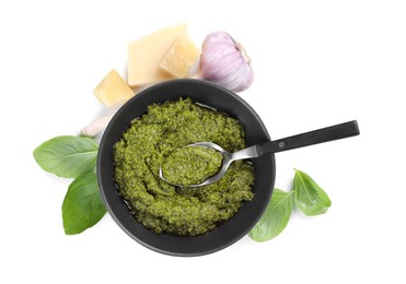 Fresh tasty pesto sauce and ingredients isolated on white, top view