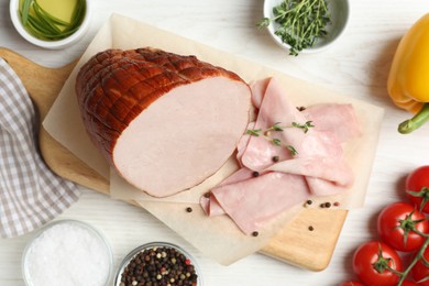 Photo of Delicious ham and ingredients on white wooden table, flat lay