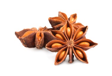 Dry anise stars with seeds on white background