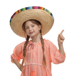 Photo of Cute girl in Mexican sombrero hat pointing at something on white background