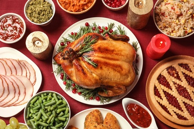 Traditional festive dinner with delicious roasted turkey served on table, flat lay