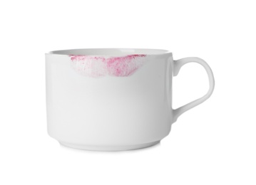 Photo of Ceramic cup with lipstick mark on white background