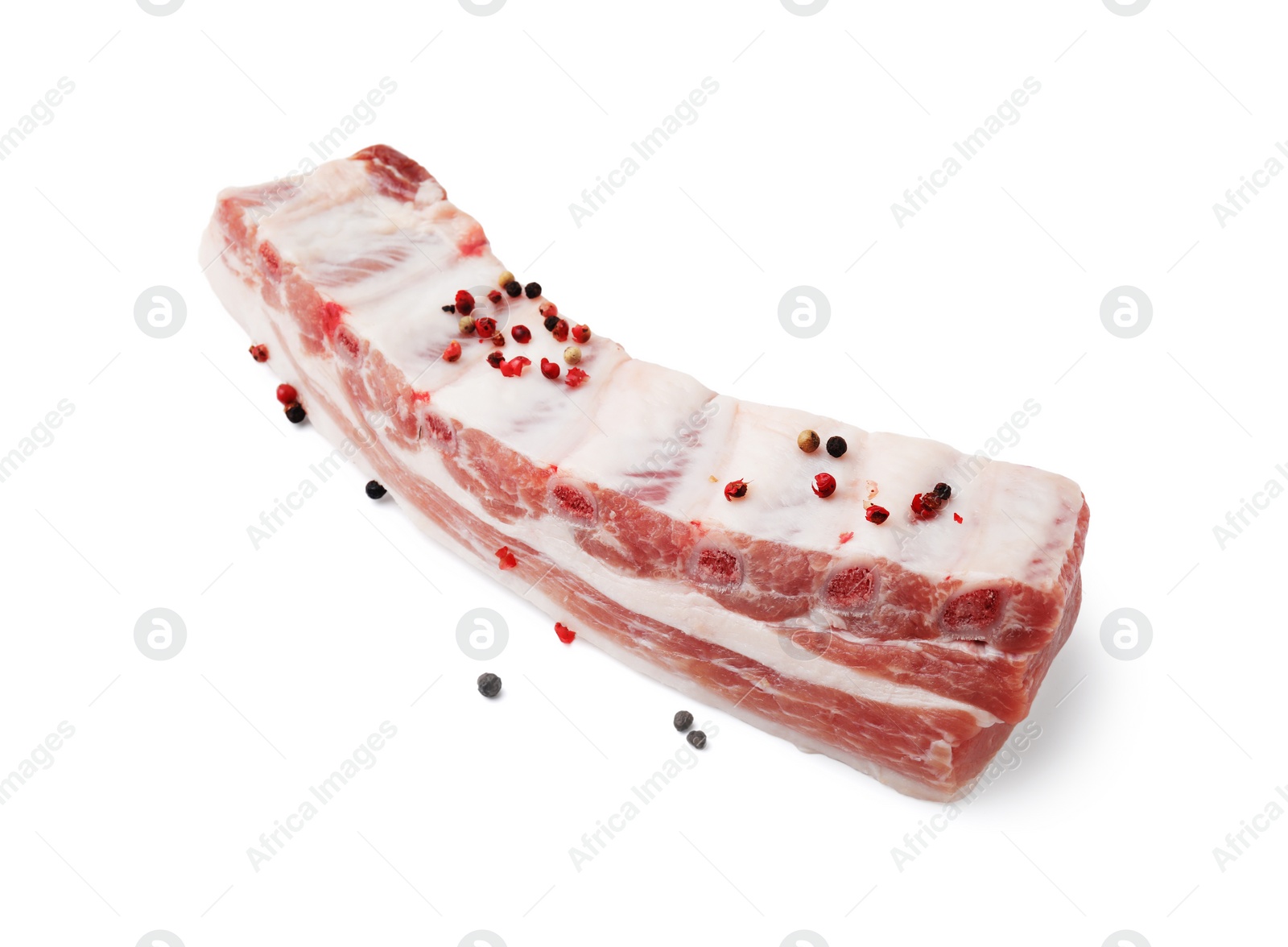 Photo of Raw pork ribs with peppercorns isolated on white