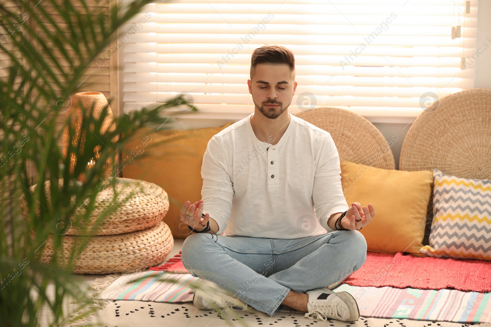 Photo of Young man during self-healing session in therapy room