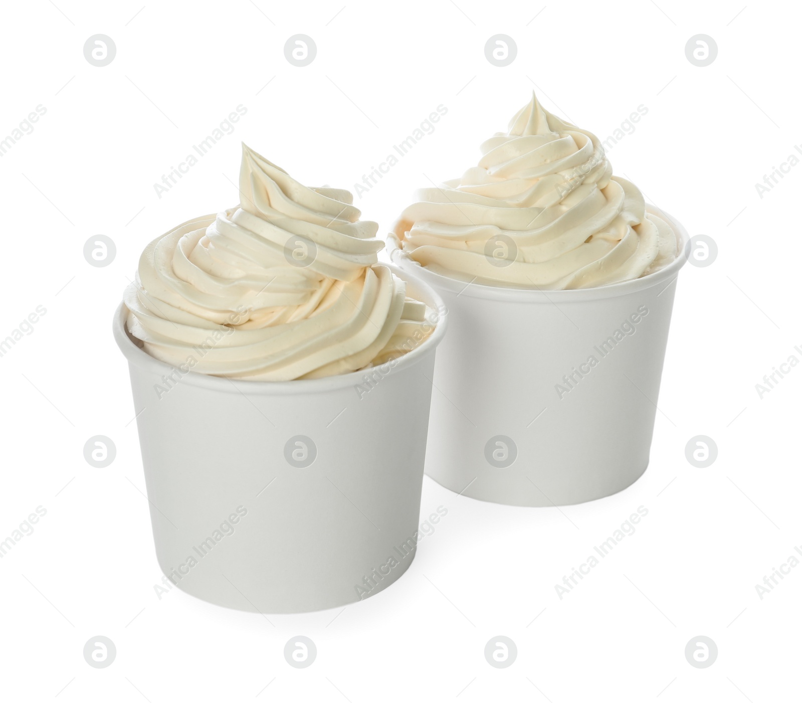 Photo of Cups with tasty frozen yogurt on white background