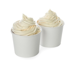 Cups with tasty frozen yogurt on white background