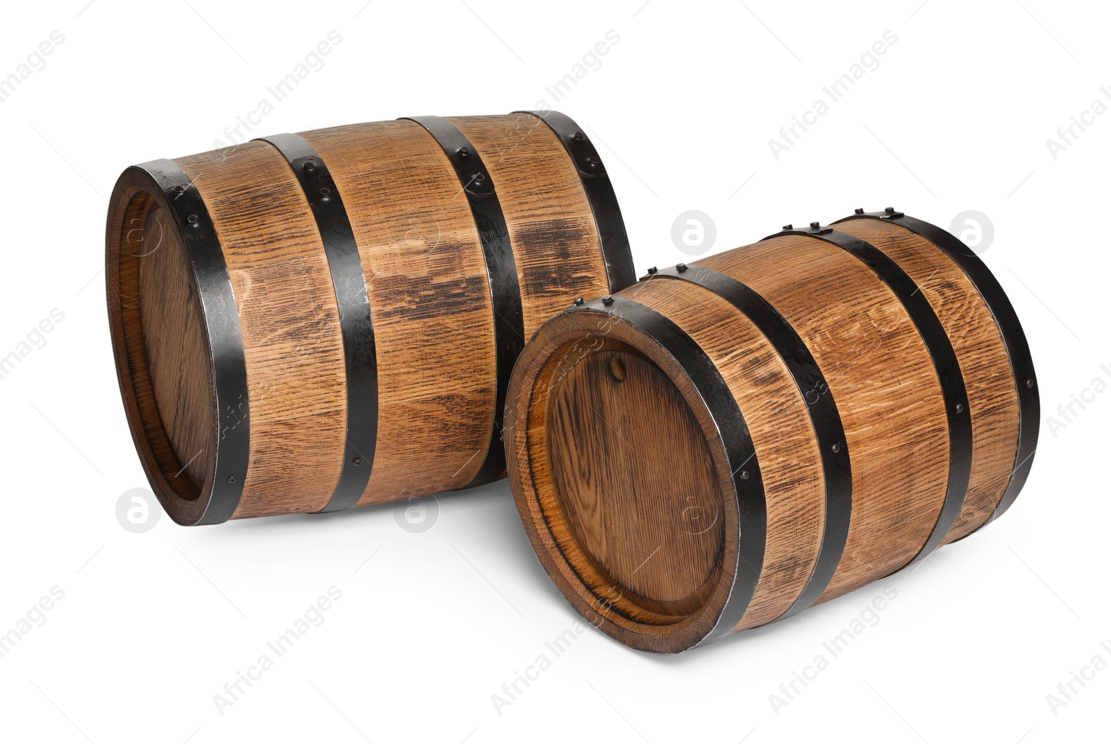 Photo of Two traditional wooden barrels on white background