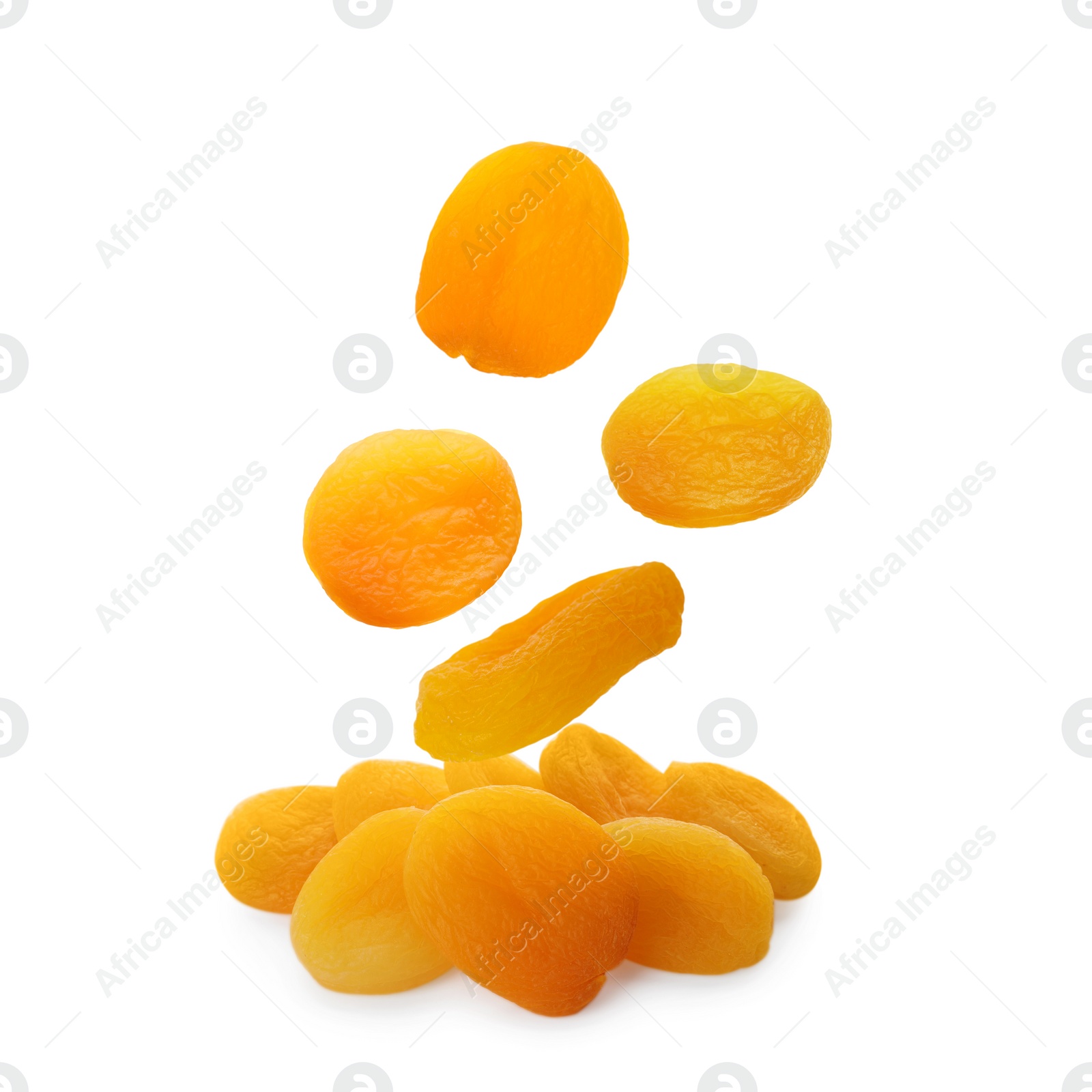 Image of Tasty dried apricots falling on white background