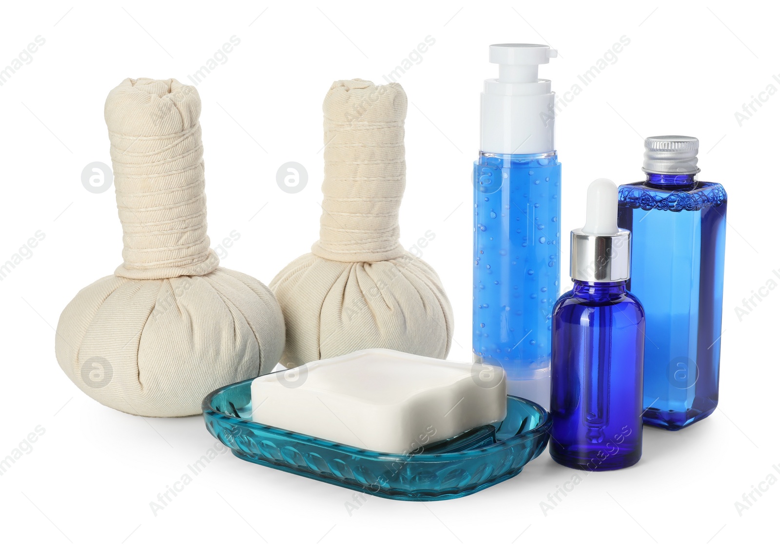 Photo of Spa composition. Bottles of cosmetic products, soap and herbal bags isolated on white