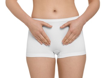 Photo of Woman holding hands near panties on white background, closeup. Women's health