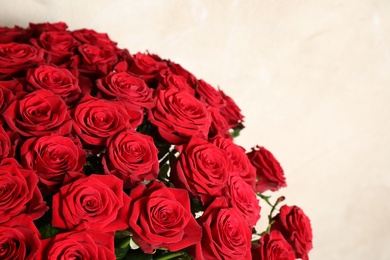 Luxury bouquet of fresh red roses on light background, closeup