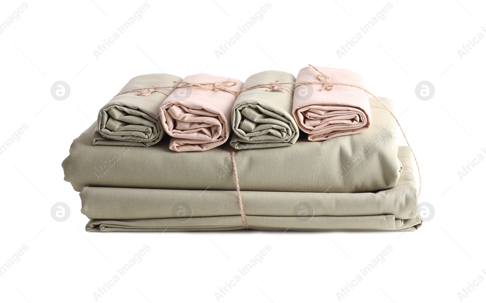 Photo of Stack of clean bed sheets tied with rope isolated on white