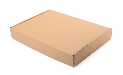 Photo of Closed cardboard box on white background. Mockup for design