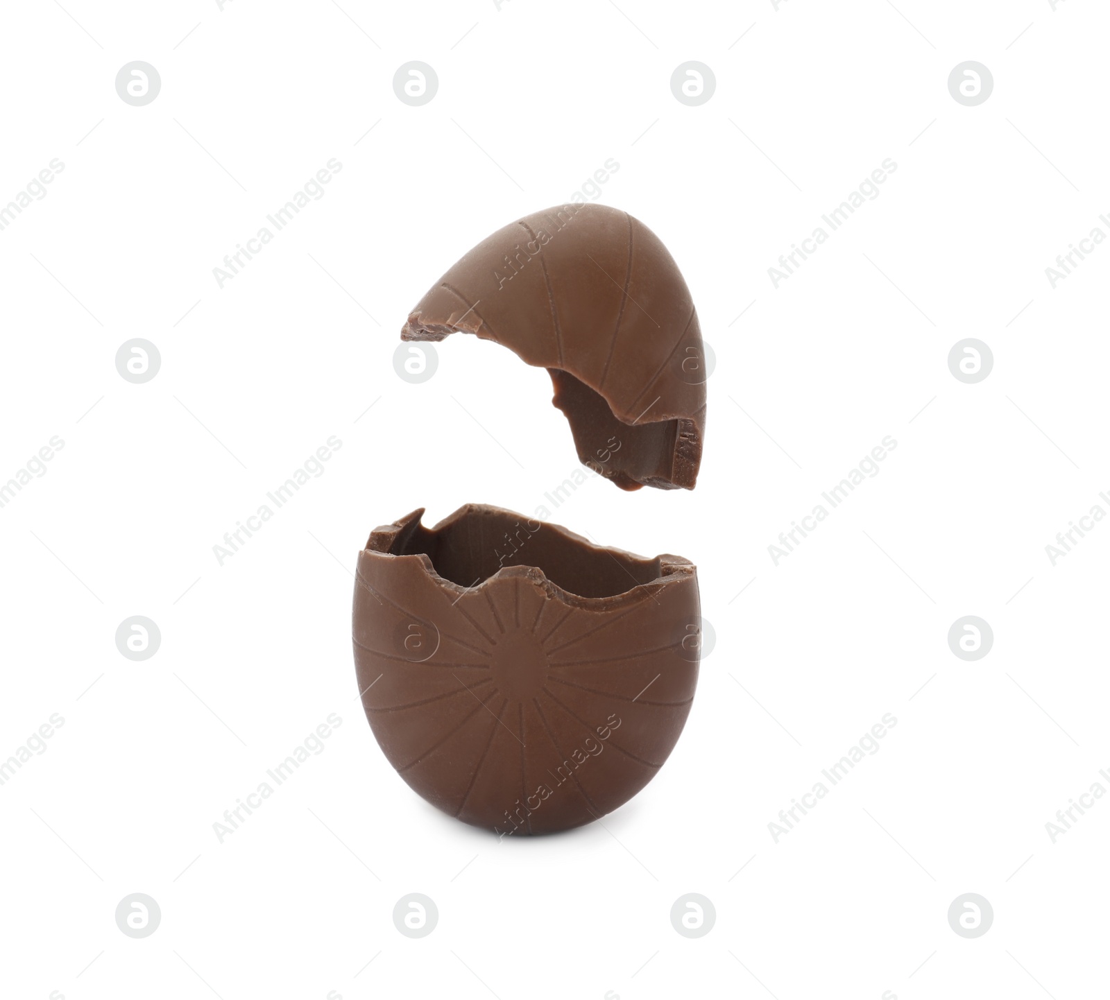 Photo of Broken milk chocolate egg on white background