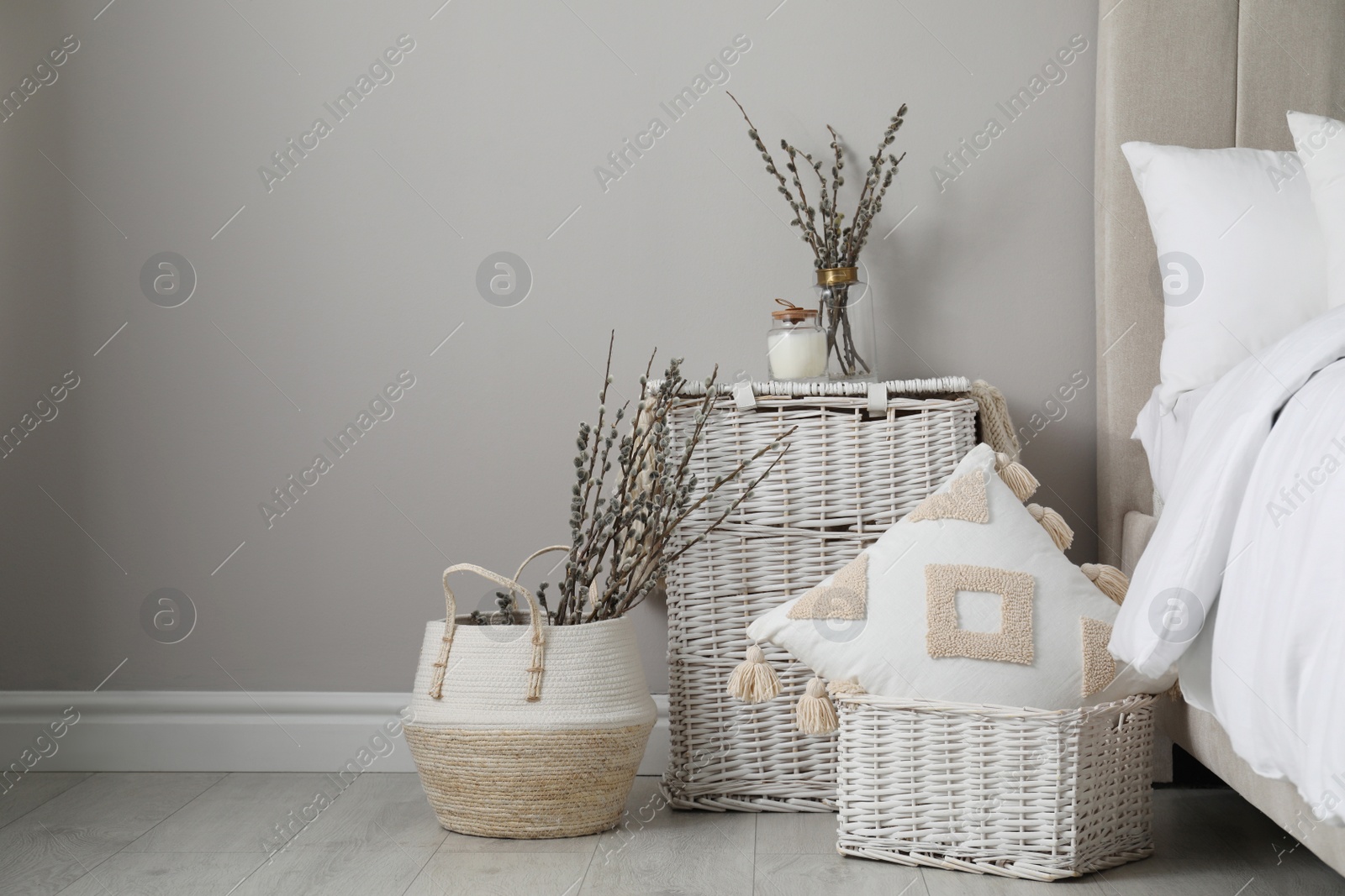 Photo of Bedroom interior with pussy willow branches and other decor