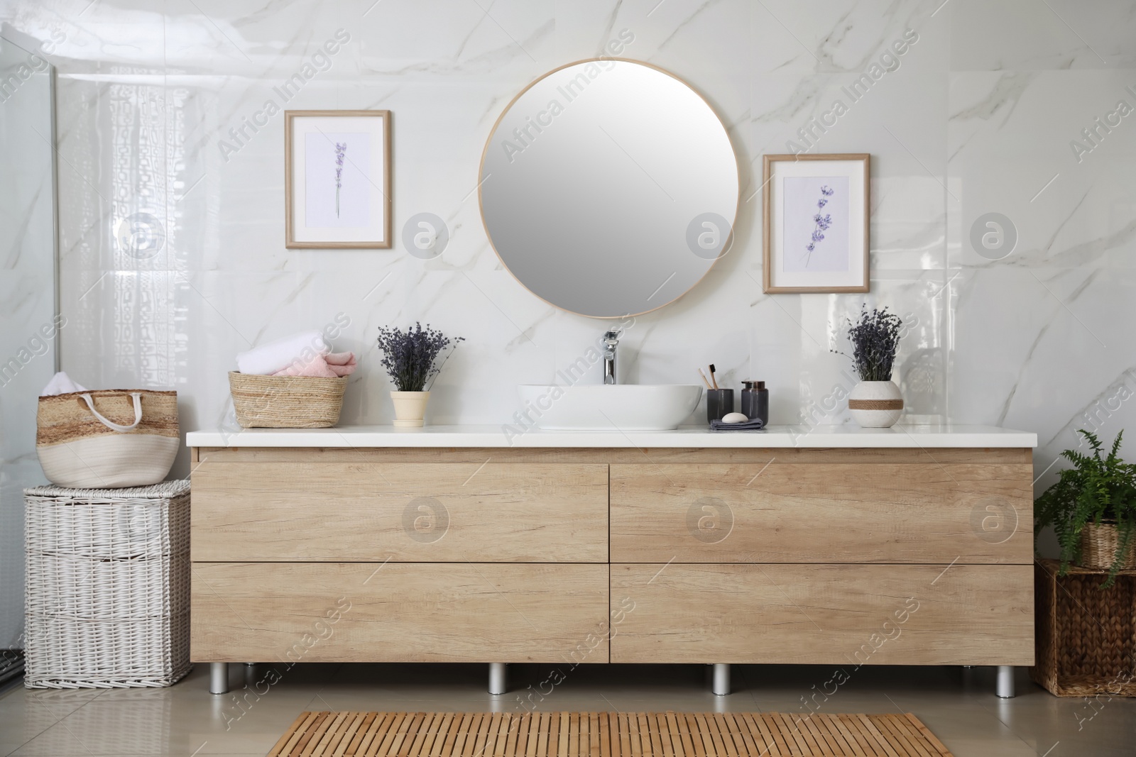 Photo of Mirror and counter with vessel sink in stylish bathroom interior. Idea for design