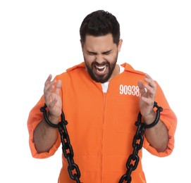Photo of Emotional prisoner in jumpsuit with chained hands on white background