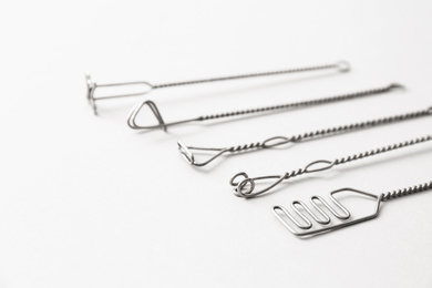 Photo of Set of logopedic probes for speech therapy on light grey background