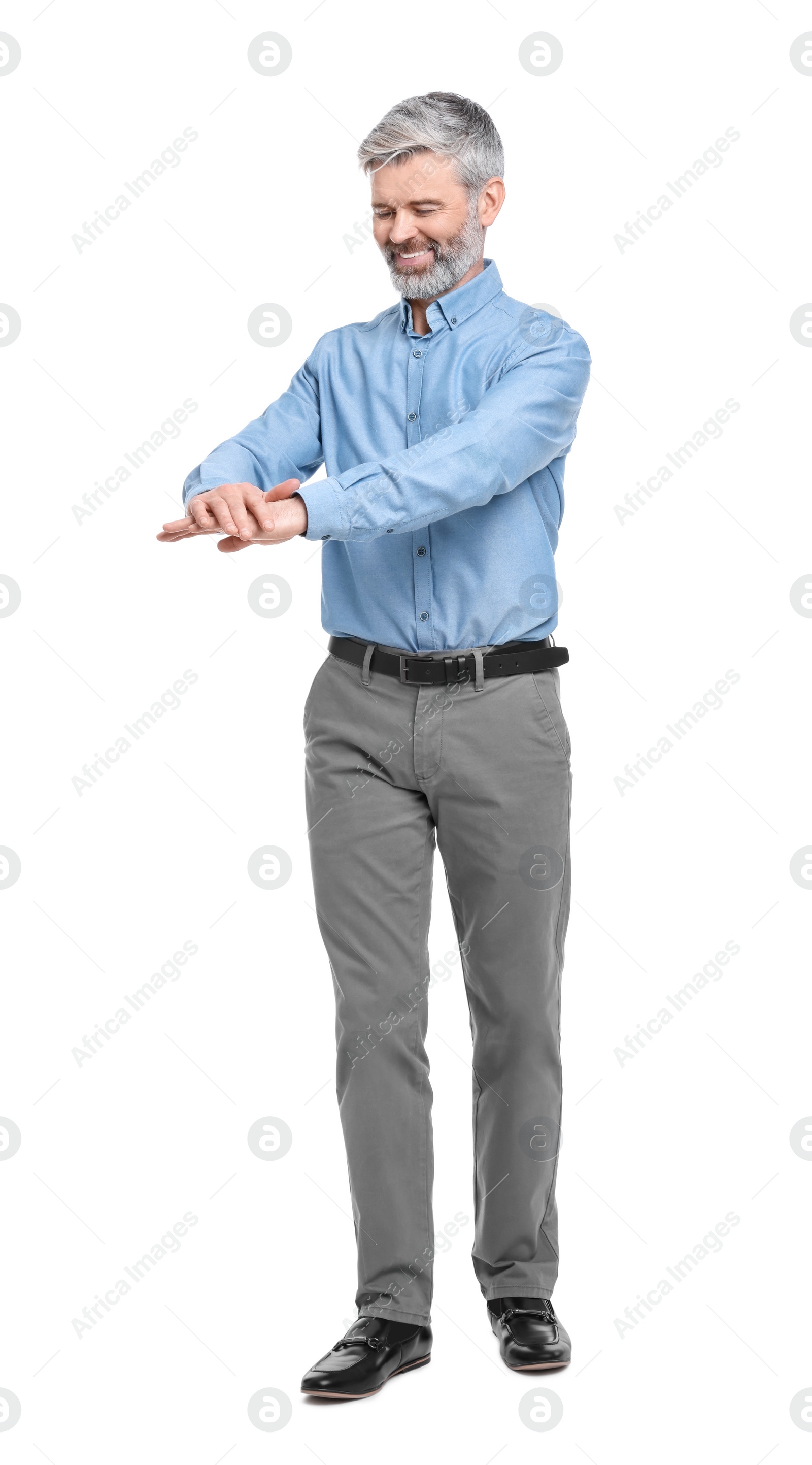 Photo of Mature businessman in stylish clothes posing on white background