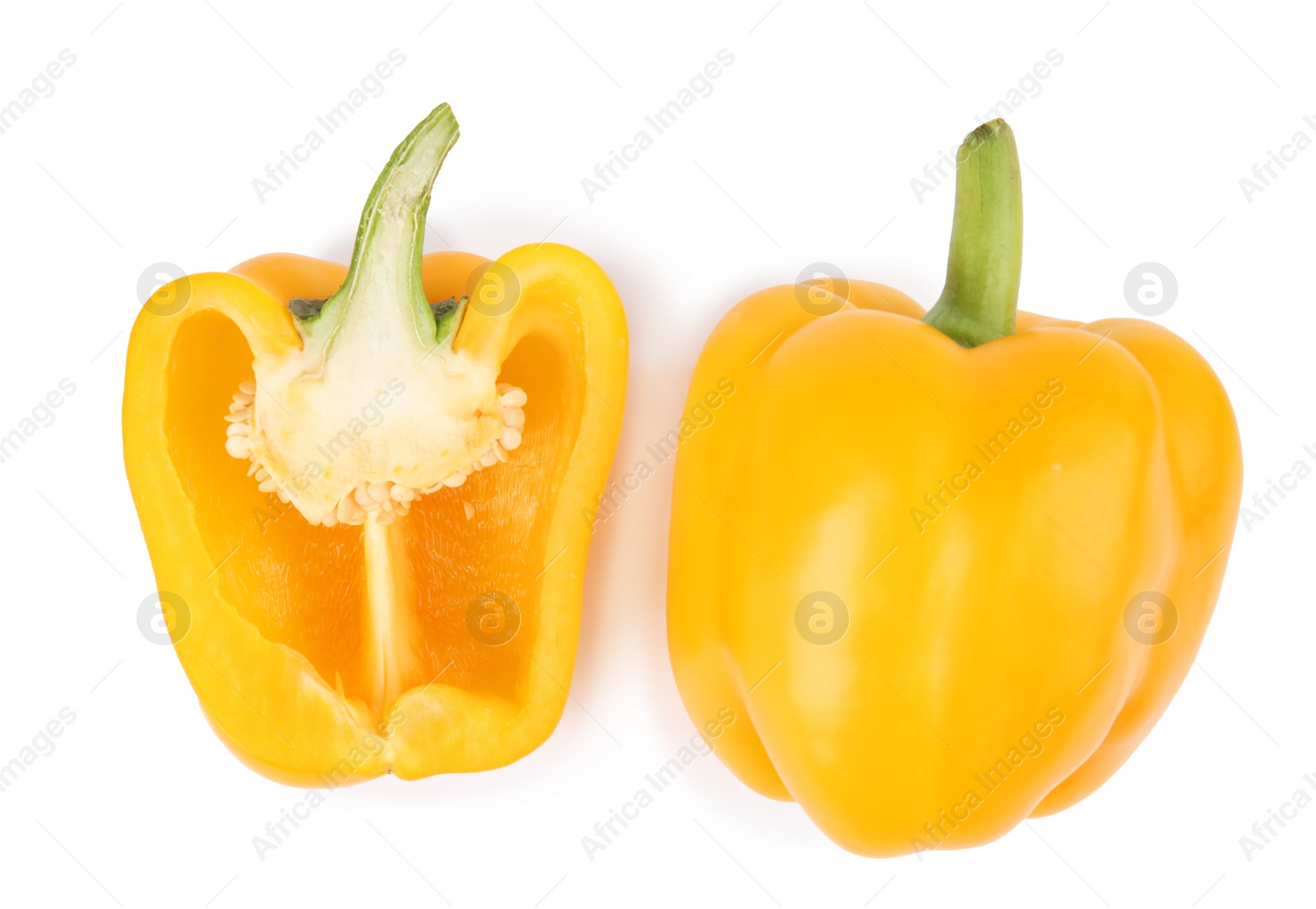 Photo of Whole and cut yellow bell peppers isolated on white