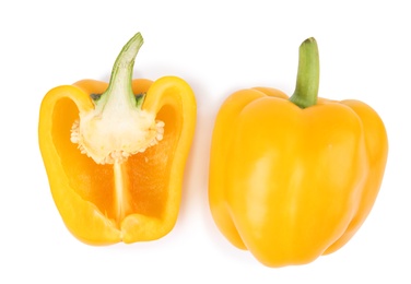 Whole and cut yellow bell peppers isolated on white