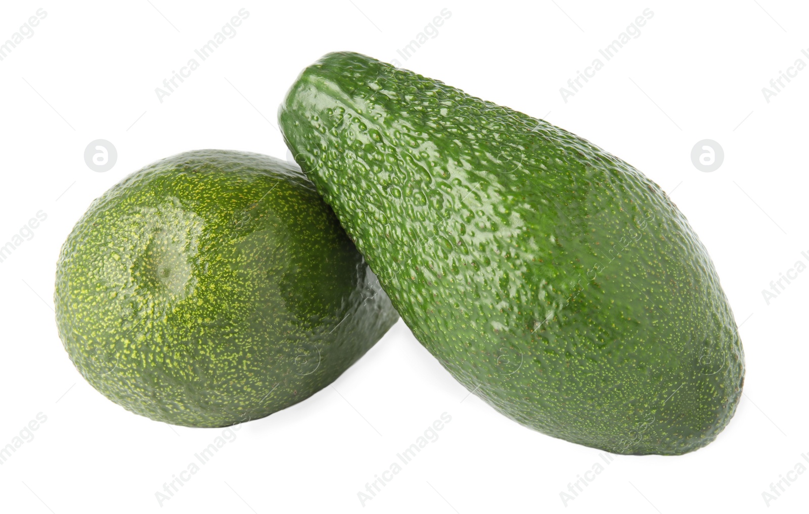 Photo of Tasty ripe avocados on white background. Tropical fruit