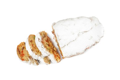 Photo of Cut delicious Stollen sprinkled with powdered sugar isolated on white, top view
