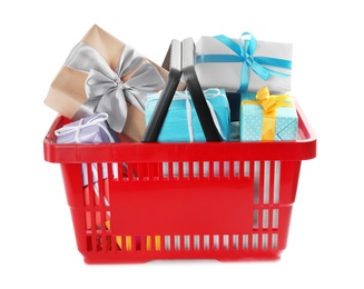 Red shopping basket with different gifts on white background