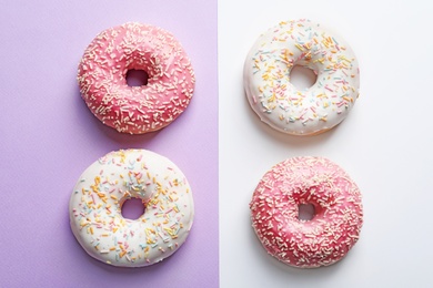 Photo of Delicious glazed doughnuts on color background, top view